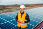 A Contractor in front of a photovoltaic system