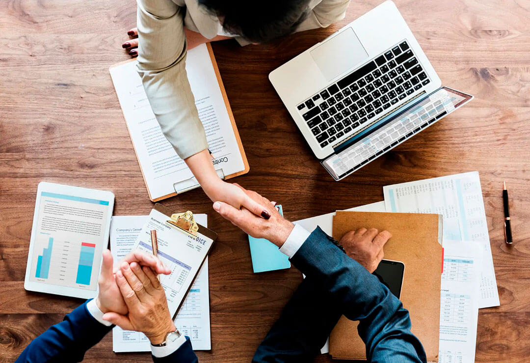 business people shaking hands together 1