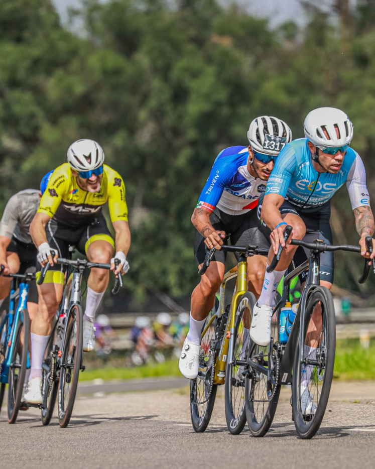 Eos Pro Cycling peloton racing in a road event